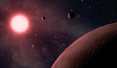 Drei Felsplaneten umkreisen einen Roten Zwerg: Die Visualisierung zeigt, wie das bisher kleinste entdeckte Sonnensystem wohl aussieht. Abb.: NASA, JPL-Caltech
